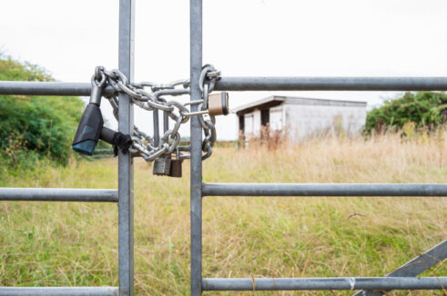 Shallow focus of a locked farm and paddock gate which has been subject to rural crime.
